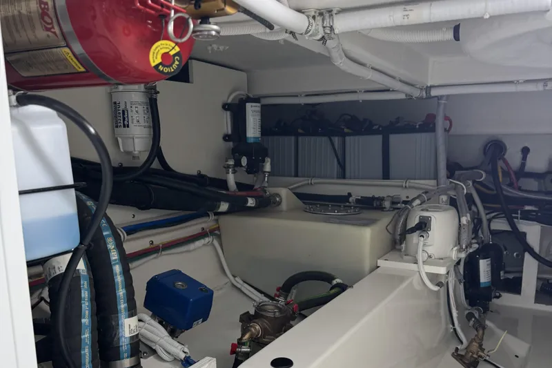 Slide: The Image of Engine room of 2025 Tiara Yachts 38 LS, showcasing mechanical components and systems. - 27
