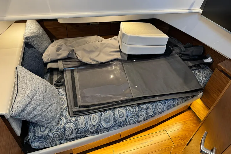 Slide: The Image of 2025 Tiara Yachts 38 LS cabin interior with bedding and cushions. - 29