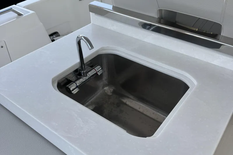 Slide: The Image of Stainless steel sink on 2025 Tiara Yachts 38 LS boat, featuring modern faucet design. - 6