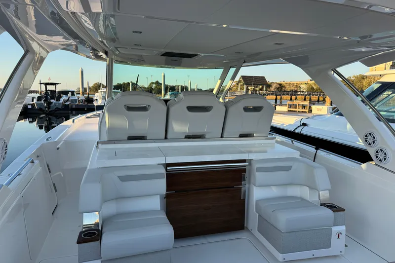 Slide: The Image of 2025 Tiara Yachts 38 LS luxury boat interior with seating and helm station. - 8