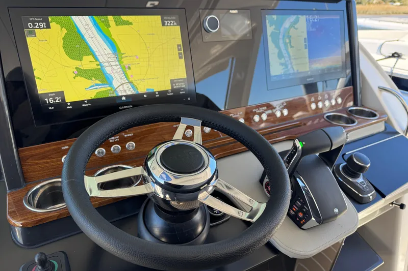 Slide: The Image of 2025 Tiara Yachts 38 LS helm with advanced navigation displays and controls. - 9