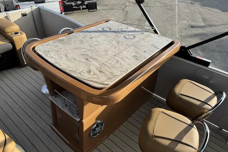 Slide: The Image of 2026 Avalon 2585 25 Catalina ENT boat interior with elegant table and seating. - 12