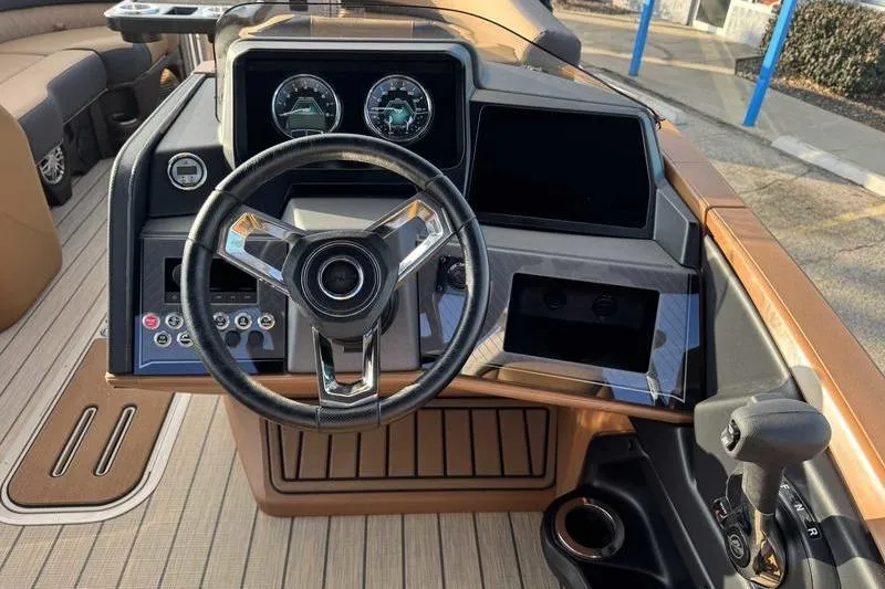 Slide: The Image of Steering console of 2026 Avalon 2585 25 Catalina ENT boat with modern controls. - 14