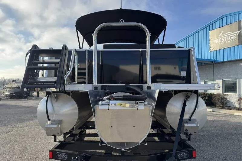 Slide: The Image of 2026 Avalon 2585 25 Catalina ENT pontoon boat rear view at dealership. - 3