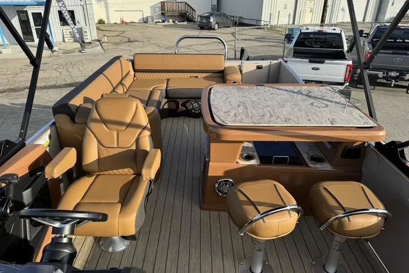 Slide: The Image of 2026 Avalon 2585 25 Catalina ENT boat interior with tan seating and table. - 5