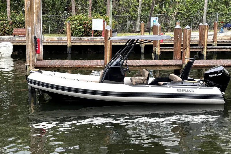 The Image of 2025 Brig NAVIGATOR22 boat docked, featuring sleek design and Mercury outboard motor. - 0