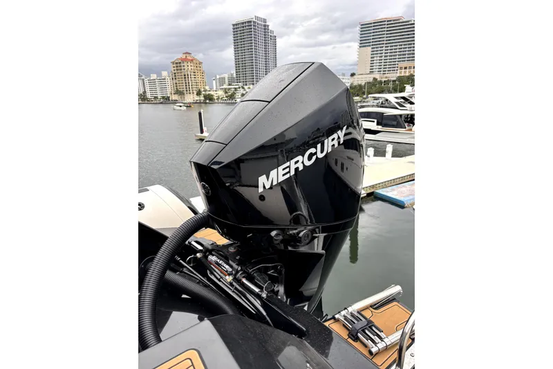 Slide: The Image of 2025 Brig NAVIGATOR22 with Mercury outboard engine at marina. - 13
