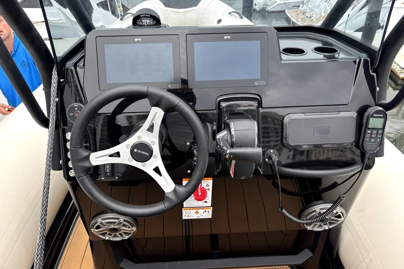 Slide: The Image of Steering console of 2025 Brig NAVIGATOR22 boat with dual screens and modern controls. - 3
