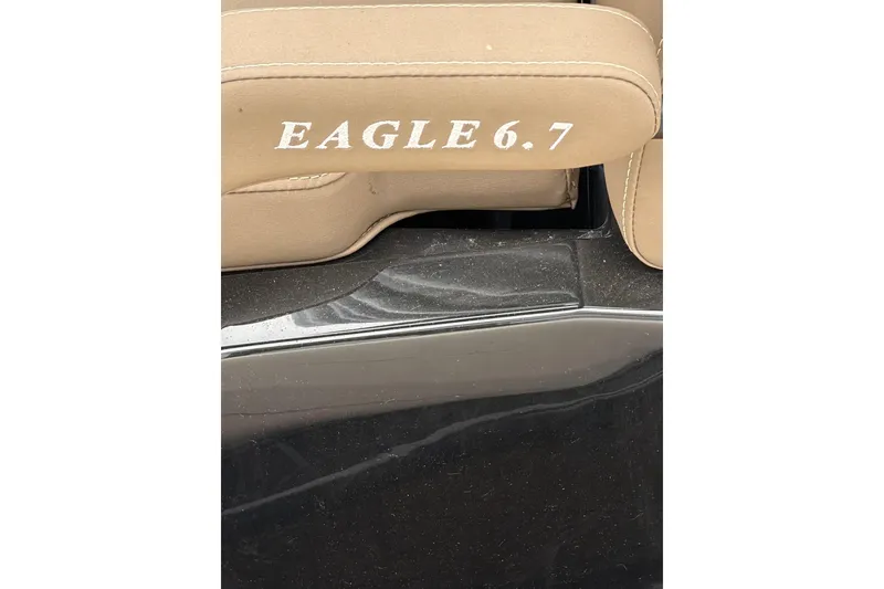 Slide: The Image of Tan seat with "EAGLE 6.7" text on a Brig NAVIGATOR22, 2025 model. - 23