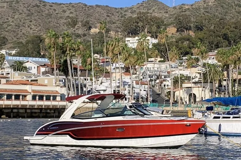 Slide: The Image of 2019 Formula 310 Bowrider boat interior with spacious seating and modern dashboard. - 14