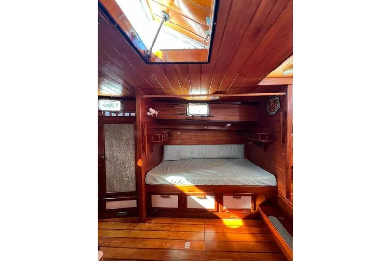 Slide: The Image of Cozy wooden cabin interior of 1993 Custom Baraka 46 yacht with skylight and bed. - 10