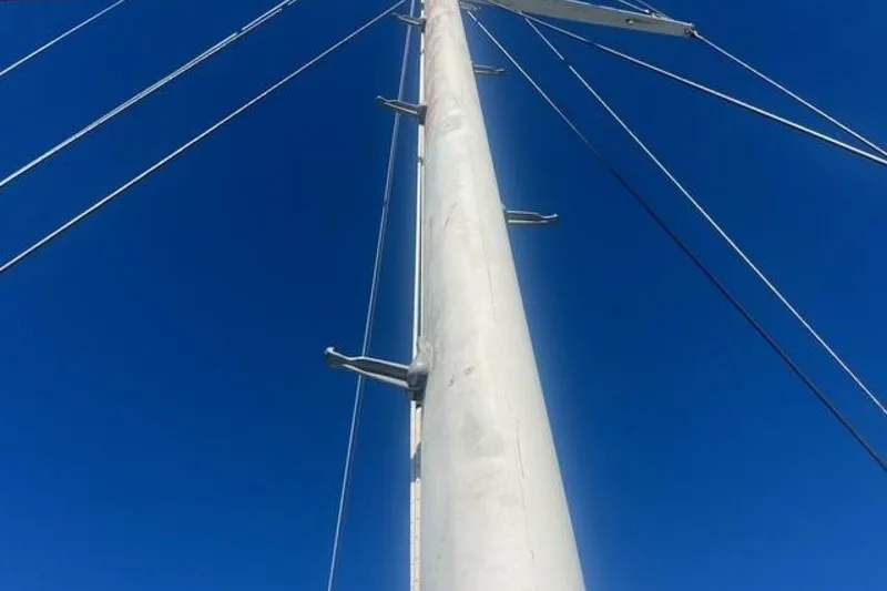 Slide: The Image of Sailboat mast of Custom Baraka 46, 1993, against clear blue sky. - 16