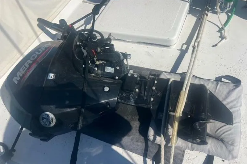 Slide: The Image of Outboard motor on a Custom Baraka 46 boat, 1993 model, resting on deck. - 19