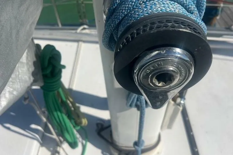 Slide: The Image of Close-up of a winch on a 1993 Custom Baraka 46 sailboat deck. - 21