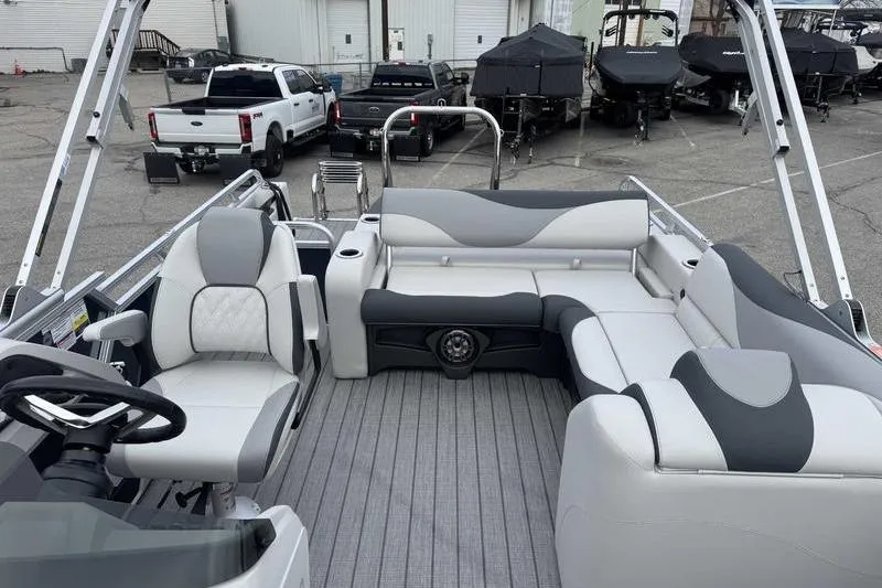 Slide: The Image of 2026 Avalon 2385 25 LSZ VRB pontoon boat interior with modern seating and steering wheel. - 10
