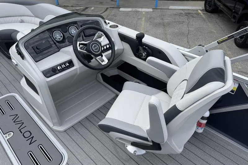 Slide: The Image of 2026 Avalon 2385 25 LSZ VRB boat interior with modern steering console and seating. - 11