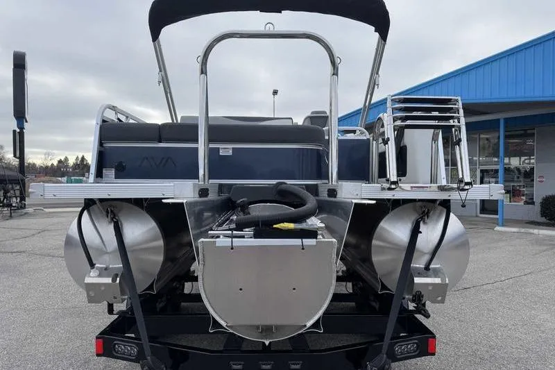 Slide: The Image of 2026 Avalon 2385 25 LSZ VRB pontoon boat rear view in a parking lot. - 5