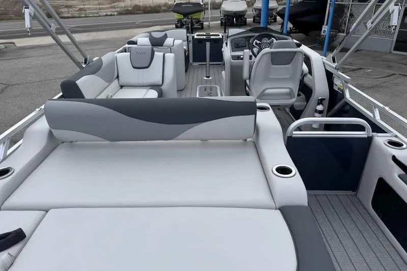 Slide: The Image of 2026 Avalon 2385 25 LSZ VRB pontoon boat interior with modern seating and steering console. - 6