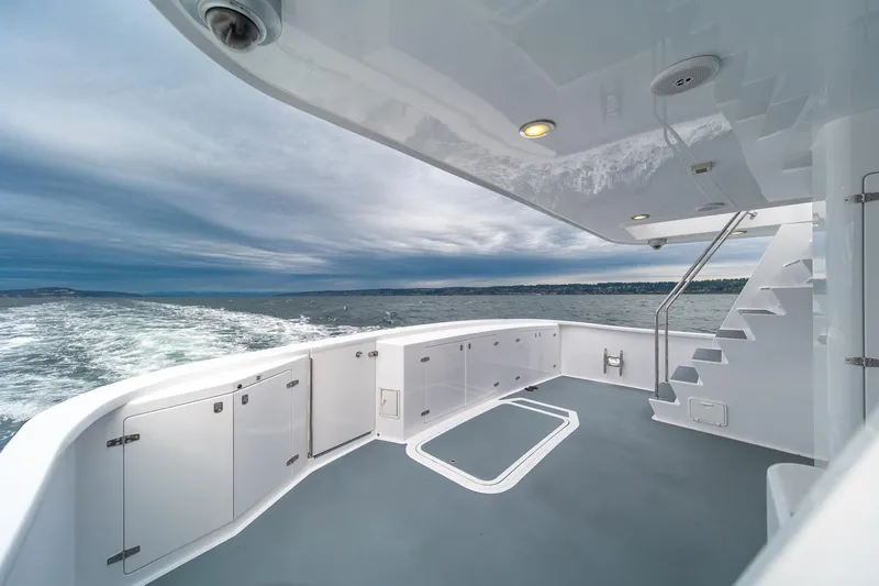 Slide: The Image of Luxurious 2004 Northern Marine 80' Tri-Deck yacht deck with ocean view and sleek design. - 12