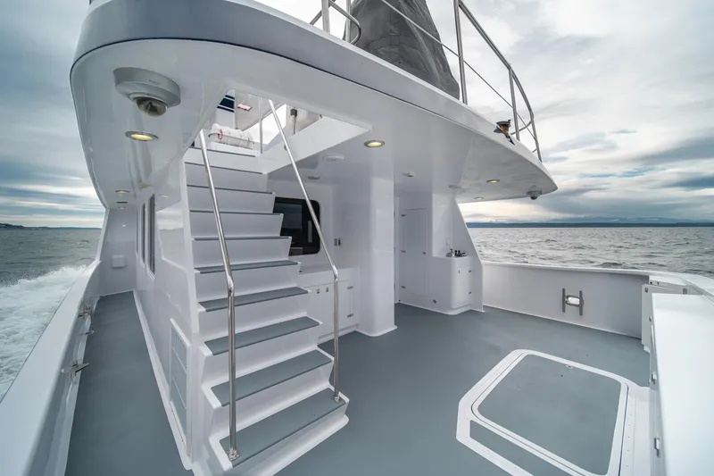 Slide: The Image of Luxurious 2004 Northern Marine 80' Tri-Deck yacht with sleek design and ocean view. - 13
