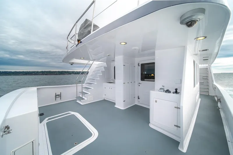 Slide: The Image of Luxurious 2004 Northern Marine 80' Tri-Deck yacht deck with stairs and ocean view. - 14