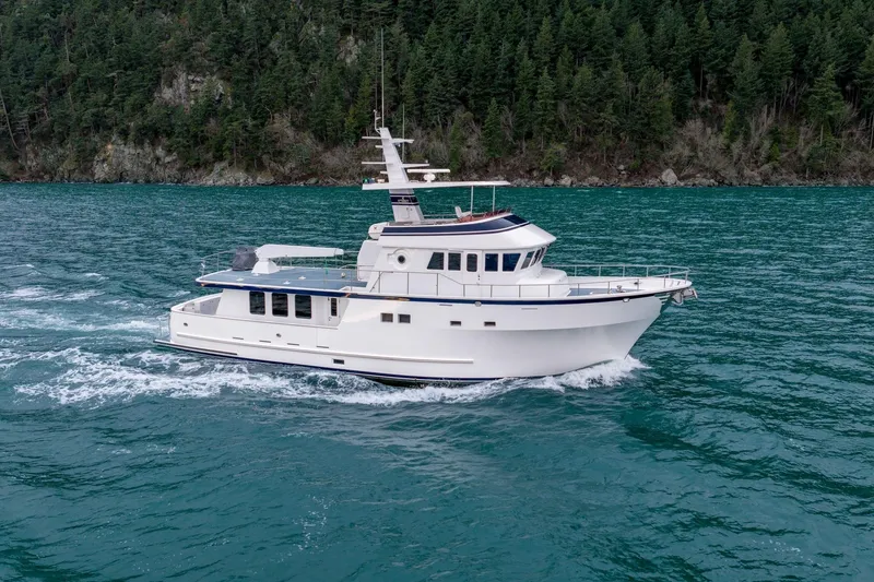 Slide: The Image of Luxury 2004 Northern Marine 80' Tri-Deck yacht cruising on scenic waters. - 2