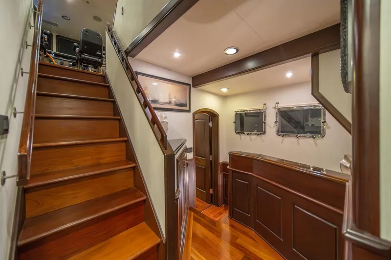 Slide: The Image of Luxurious interior of 2004 Northern Marine 80' Tri-Deck yacht with elegant wood finishes. - 26