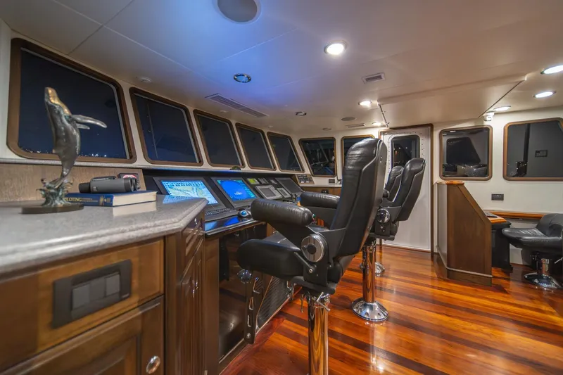 Slide: The Image of Luxurious helm of 2004 Northern Marine 80' Tri-Deck Expedition yacht with polished wood flooring. - 29