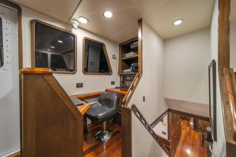 Slide: The Image of Luxurious interior of 2004 Northern Marine 80' Tri-Deck yacht with wood accents and seating. - 31
