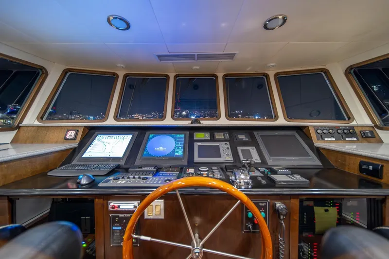 Slide: The Image of Cockpit of 2004 Northern Marine 80' Tri-Deck Expedition yacht with advanced navigation systems. - 32