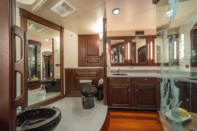 Slide: The Image of Luxurious bathroom in 2004 Northern Marine 80' Tri-Deck yacht with elegant wood cabinetry. - 36