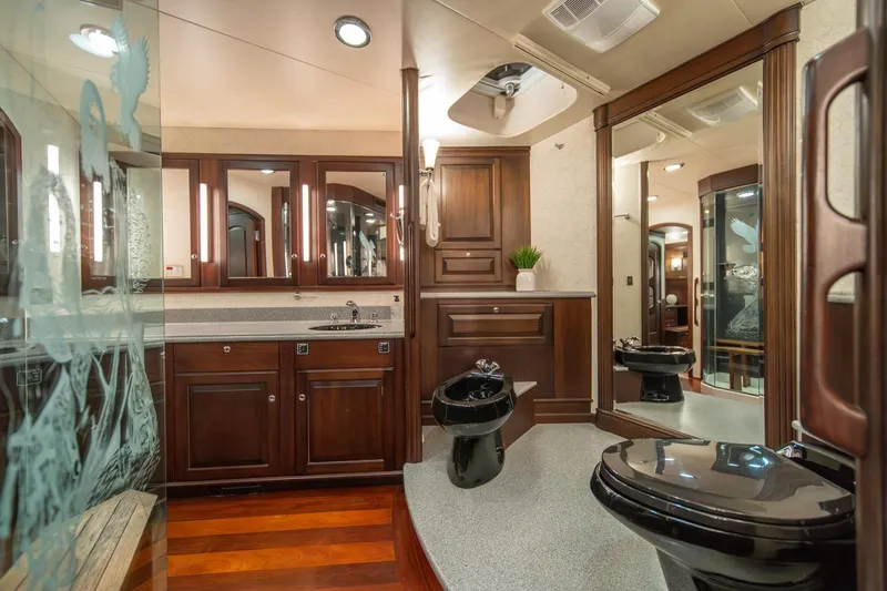 Slide: The Image of Luxurious bathroom in 2004 Northern Marine 80' Tri-Deck yacht with elegant wood cabinetry. - 37