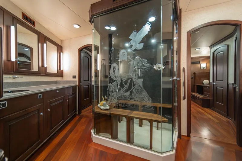 Slide: The Image of Luxurious yacht bathroom with etched glass shower, wooden cabinetry, and elegant lighting, Northern Marine 80' Tri-Deck. - 39