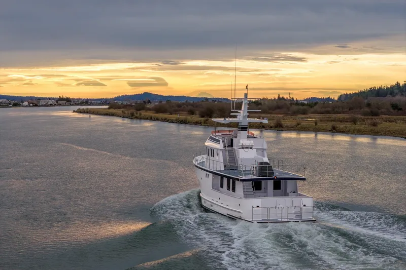 Slide: The Image of Luxury Northern Marine 80' Tri-Deck yacht cruising at sunset, 2004 model. - 4