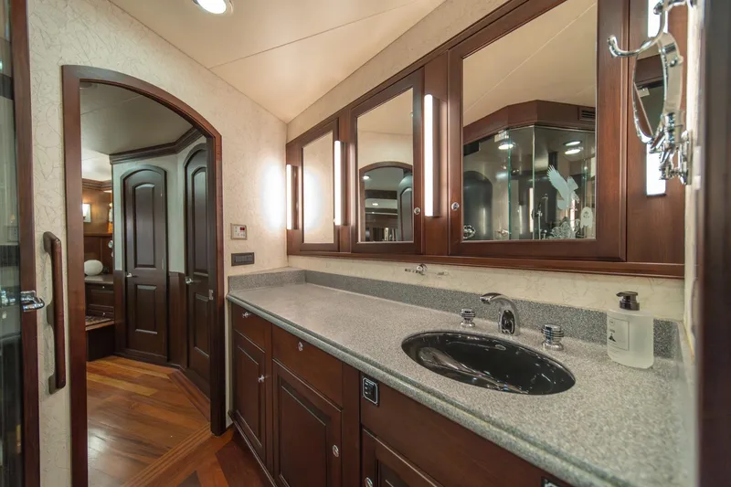 Slide: The Image of Luxurious bathroom in 2004 Northern Marine 80' Tri-Deck yacht with elegant wood cabinetry. - 41
