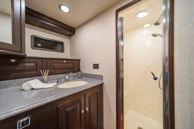 Slide: The Image of Luxurious bathroom in 2004 Northern Marine 80' Tri-Deck yacht with modern fixtures and shower. - 48