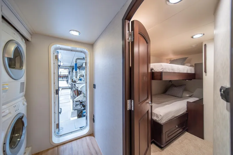 Slide: The Image of Interior of 2004 Northern Marine 80' Tri-Deck yacht with bunk beds and laundry area. - 49