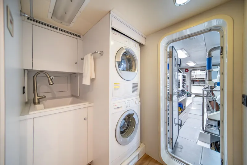 Slide: The Image of Laundry area on 2004 Northern Marine 80' Tri-Deck Expedition yacht with washer, dryer, and sink. - 51