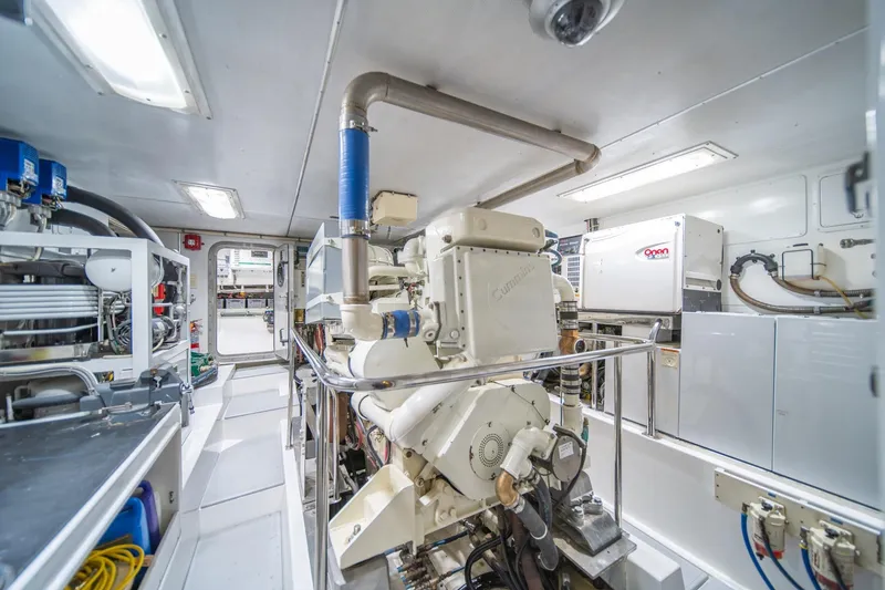 Slide: The Image of Engine room of 2004 Northern Marine 80' Tri-Deck Expedition yacht, showcasing machinery and equipment. - 53