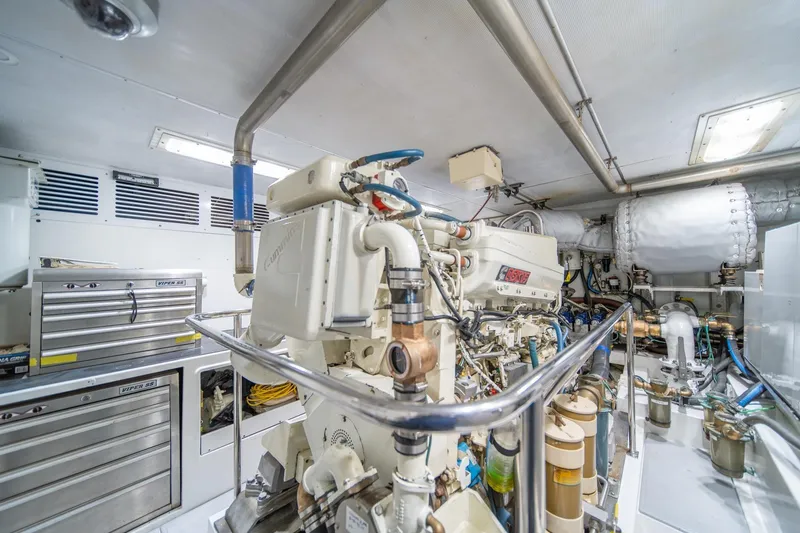 Slide: The Image of Engine room of 2004 Northern Marine 80' Tri-Deck Expedition yacht, featuring Cummins machinery. - 54