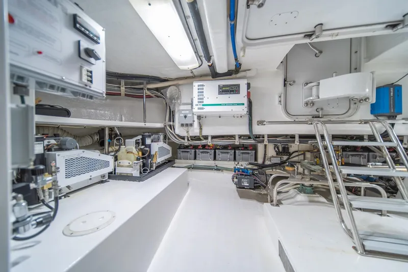 Slide: The Image of Engine room of 2004 Northern Marine 80' Tri-Deck Expedition yacht, showcasing equipment and controls. - 56