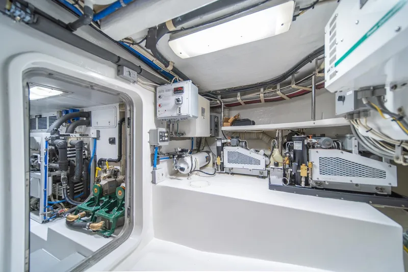Slide: The Image of Engine room of 2004 Northern Marine 80' Tri-Deck Expedition yacht, showcasing machinery and equipment. - 57