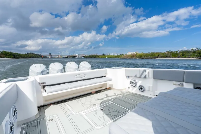 Slide: The Image of 2023 Blackwater High-Performance boat interior with powerful engines, cruising on a sunny day. - 13