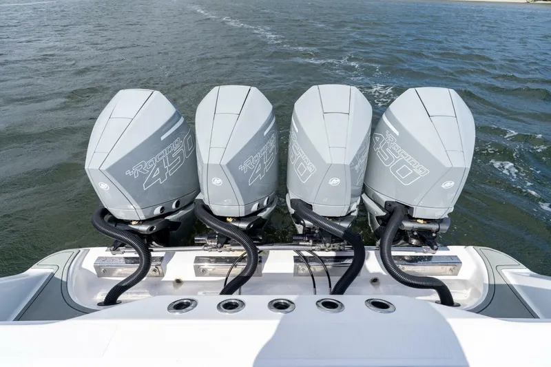 Slide: The Image of Four powerful outboard engines on a 2023 Blackwater High-Performance boat. - 15
