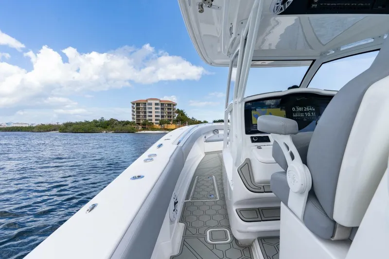 Slide: The Image of 2023 Blackwater High-Performance boat interior with scenic waterfront view. - 17