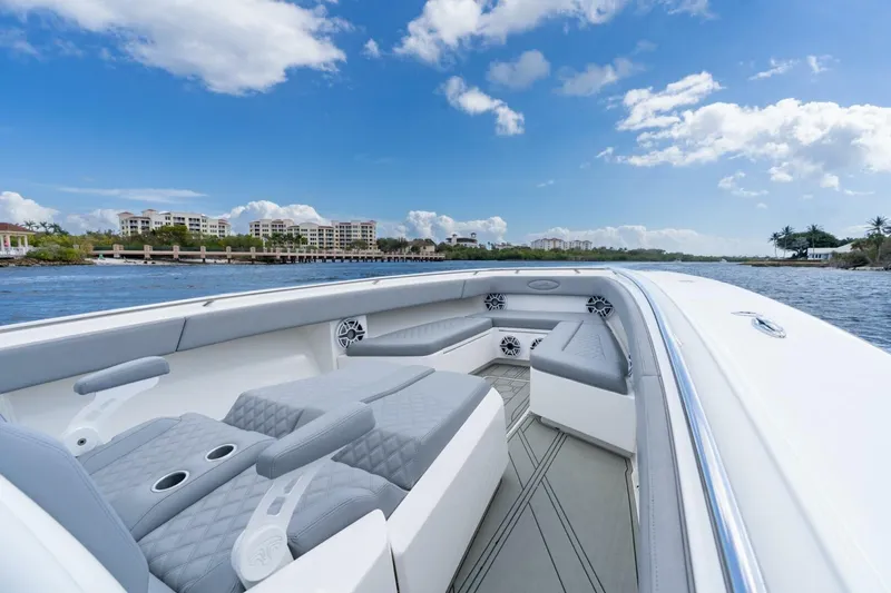 Slide: The Image of 2023 Blackwater High-Performance boat interior with luxurious seating, cruising on a sunny day. - 26