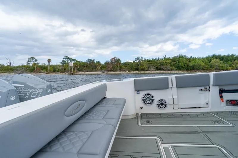 Slide: The Image of 2023 Blackwater High-Performance boat interior with seating, speakers, and scenic water view. - 31