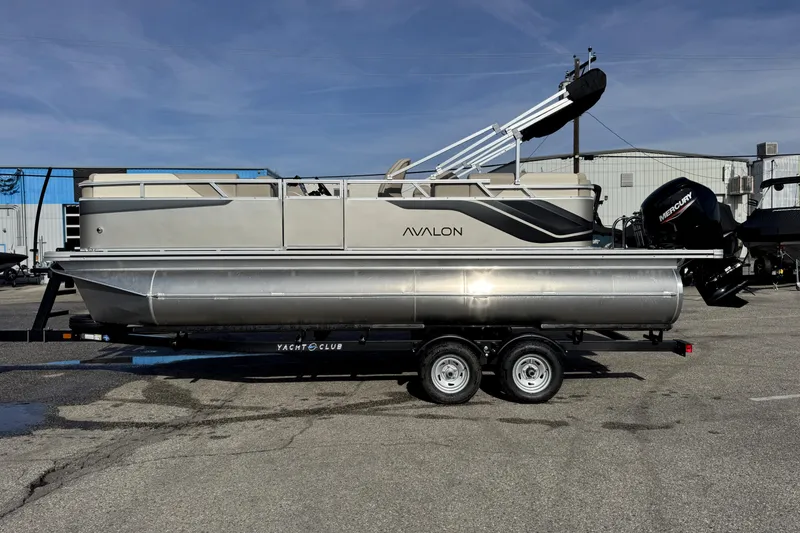 The Image of 2026 Avalon 2180 23 Venture QL pontoon boat on trailer, parked outdoors. - 0