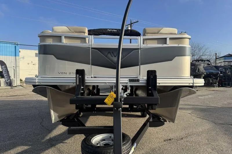Slide: The Image of 2026 Avalon 2180 23 Venture QL pontoon boat on trailer, sunny day. - 3