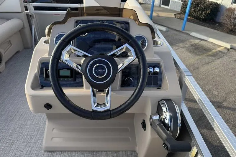 Slide: The Image of Steering console of 2026 Avalon 2180 23 Venture QL boat, featuring modern controls. - 7